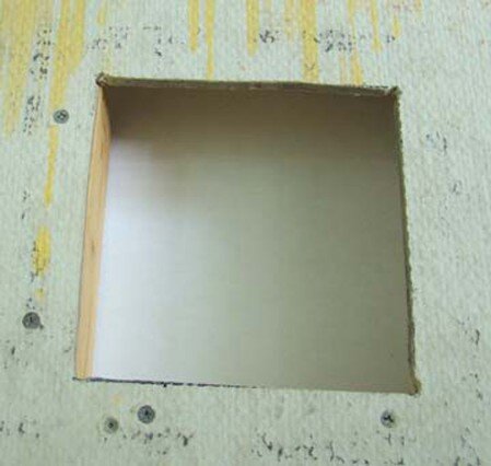 Hole cut in sheetrock wall for recessed bath hardware Hole cut in sheetrock wall for recessed bath hardware
