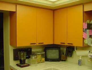 Before photo of a bank of cabinets