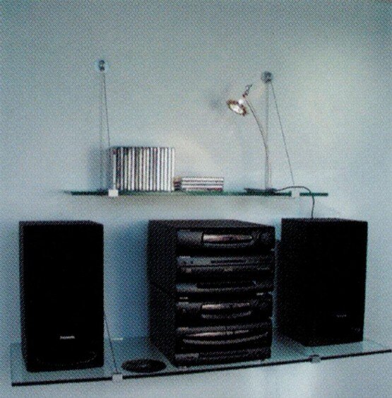 Expo Design different size glass shelves stacked above each other Expo Design different size glass shelves stacked above each other