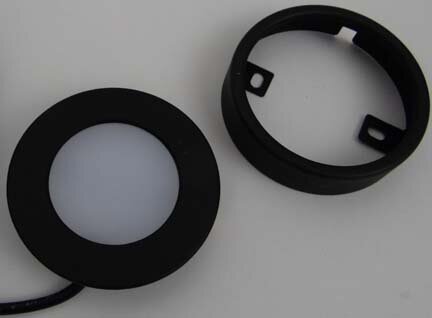 Loox 2020 LED light shown with optional surface mount ring