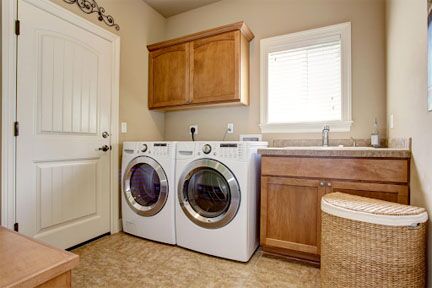 Laundry Room with nice wood cabinets